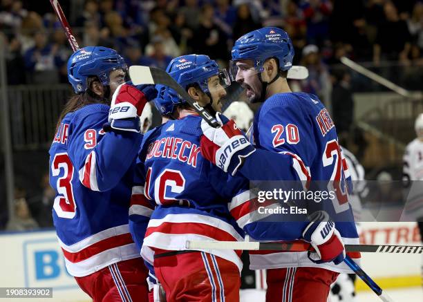 Chris Kreider of the New York Rangers celebrates his goal with teammates Mika Zibanejad and Vincent Trocheck during the second period against the...