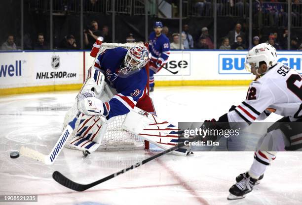 Igor Shesterkin of the New York Rangers clears a shot by Brett Seney of the Chicago Blackhawks during the third period at Madison Square Garden on...