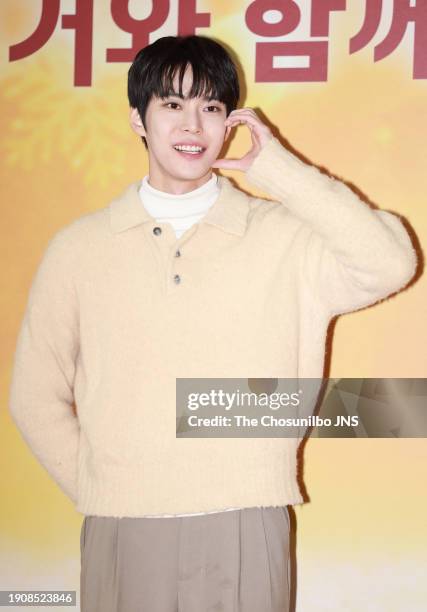 December 27: Doyoung of NCT attends McDonald's holiday menu 'Lucky Burger' photowall event at McDonald Sangam DMC in Mapo-gu on December 27, 2023 in...