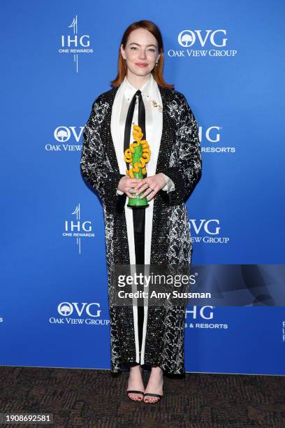 Emma Stone, winner of the Desert Palm Achievement Award, Actress, for "Poor Things," poses backstage during the 35th Annual Palm Springs...