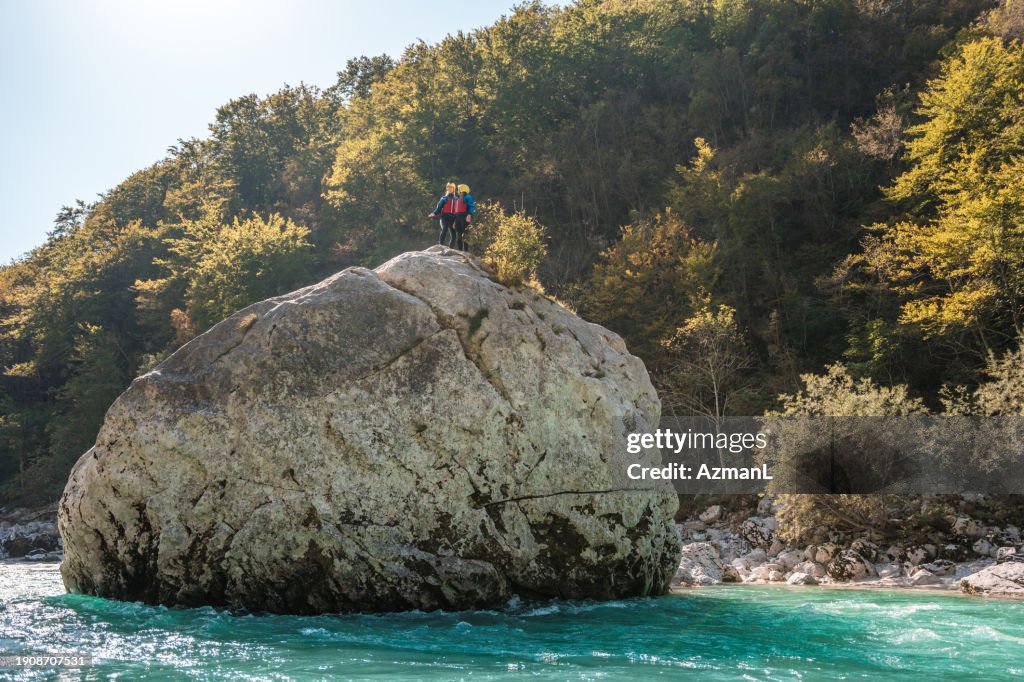 Leap Rocks Young Adult Female Conquering A River Rock Leap High-Res Stock Photo ...