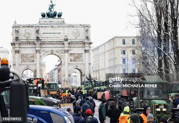 Farmers with their tractors stand at Odeonsplatz square in the city center to take part in protests against the federal government's austerity plans...