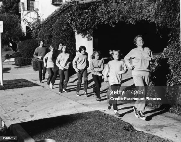 Actor Ann B. Davis leads the Brady family in a rigorous jog in a still from the television series, 'The Brady Bunch,' 1972. : Robert Reed, Florence...