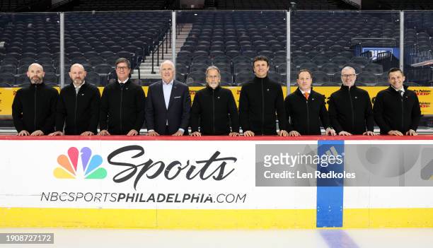 Head Coach John Tortorella of the Philadelphia Flyers poses with Adam Patterson, Darryl Williams, Brad Shaw, Dan Hilferty, Rocky Thompson, Angelo...