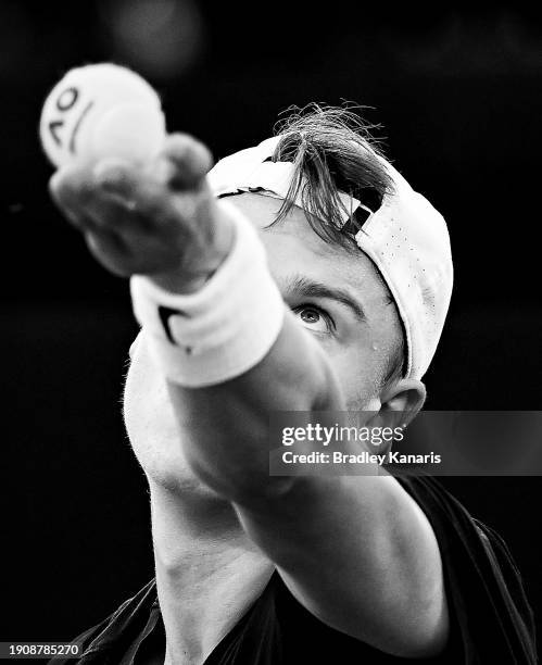 Holger Rune of Denmark serves in his match against James Duckworth of Australia during day six of the 2024 Brisbane International at Queensland...