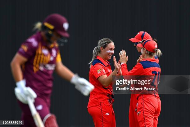 Maddie Penna of South Australia celebrates with team mates after dismissing Nicola Hancock of Queensland during the WNCL match between Queensland and...