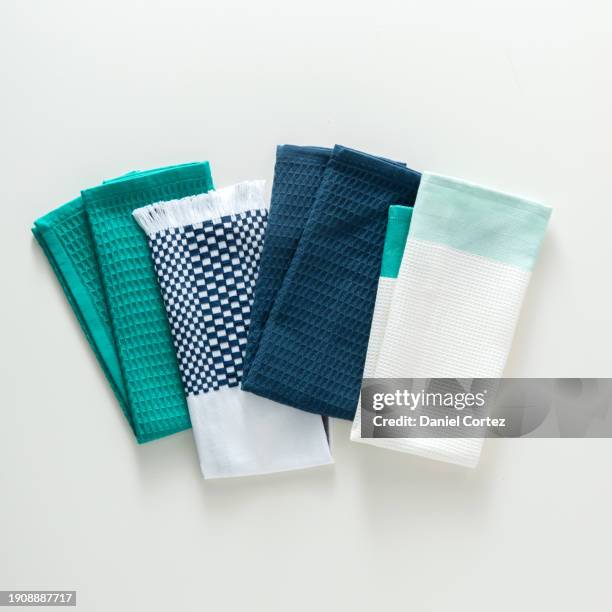 folded kitchen towels isolated on white background. top view, flat lay. - microfiber towel stock pictures, royalty-free photos & images