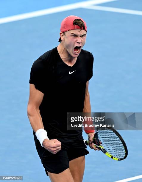 Holger Rune of Denmark celebrates victory after his match against James Duckworth of Australia during day six of the 2024 Brisbane International at...