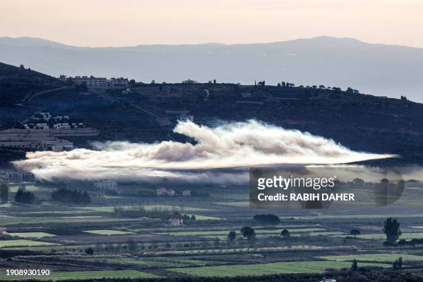 Smoke billows from Israeli bombardment in the Khiyam plains near the border with Israel in southern Lebanon on January 8, 2024 amid ongoing...