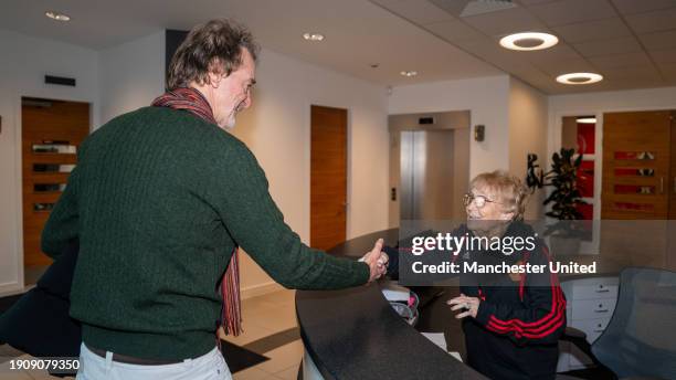 Sir Jim Ratcliffe of INEOS meets long-serving receptionist Kath Phipps of Manchester United before meeting other support staff at Carrington Training...