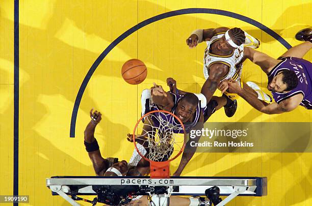 Chris Webber of the Sacramento Kings shoots against Al Harrington of the Indiana Pacers during the game at Conseco Fieldhouse on April 1, 2003 in...