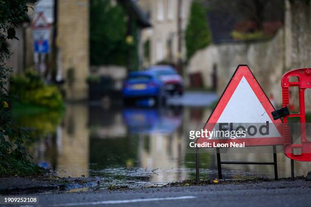 Road closures and warning signs are seen following heavy rains and sewer system overflows caused the River Cherwell to break its banks on January 05,...