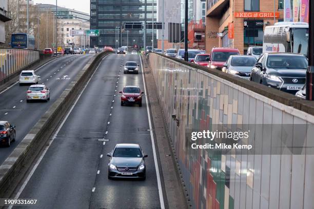 Cars in the 30mph Clean Air Zone run by Birmingham City Council along the A38 Bristol Street in the city centre on 14th December 2023 in Birmingham,...