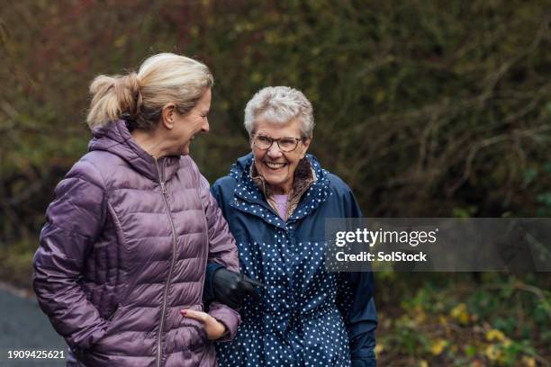 two generations on a stroll - demens bildbanksfoton och bilder