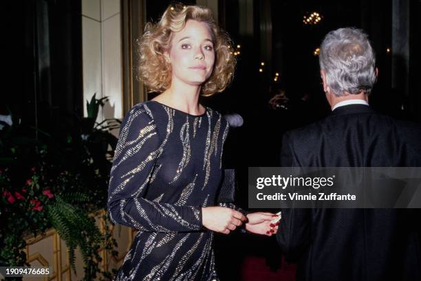 American actress Susan Dey, wearing a black outfit with silver and gold trim, and American television producer Bernard Sofronski attend the...