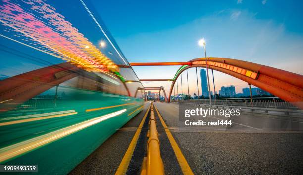 red suspension bridge - bridge architecture up close night stock pictures, royalty-free photos & images