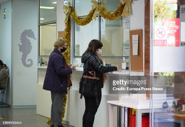 Several people wearing masks inside the Centre de Salut Chile, on January 5 in Valencia, Valencian Community, Spain. With an incidence of respiratory...