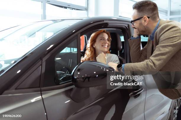 couple buying their new car - test drive stock pictures, royalty-free photos & images