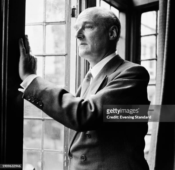 British architect John Seely, 2nd Baron Mottistone , looking out of an open window, July 28th 1958.