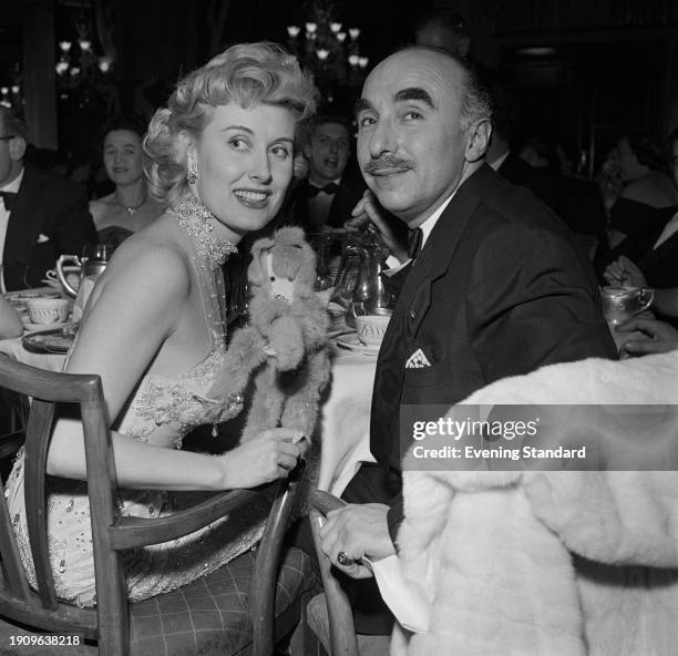 British singer Jill Day and comedian Harold Berens attending an event, March 13th 1957.