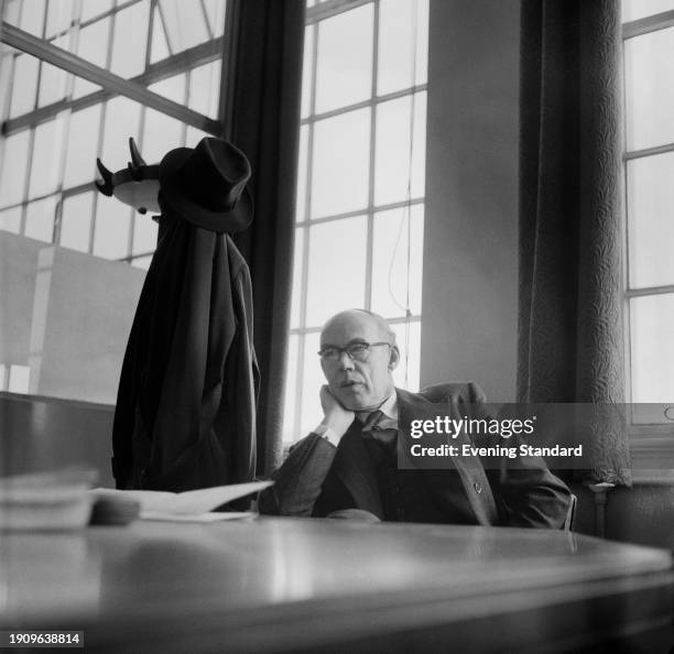 Maurice Platt, chief engineer of Vauxhall Motors, seated in an office at the company's factory in Luton, Bedfordshire, March 11th 1957.
