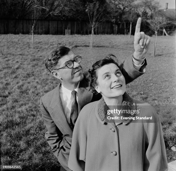 British astronomer, mathematician and science fiction writer Professor Fred Hoyle and his wife Barbara looking skyward, February 13th 1958.