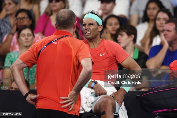 Rafael Nadal of Spain receives treatment in his match against Jordan Thompson of Australia during day six of the 2024 Brisbane International at...