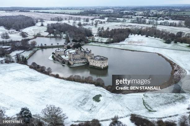 Photograph taken on January 8, 2024 shows an aerial view of Leeds Castle covered in snow in Maidstone, Kent, southern England.