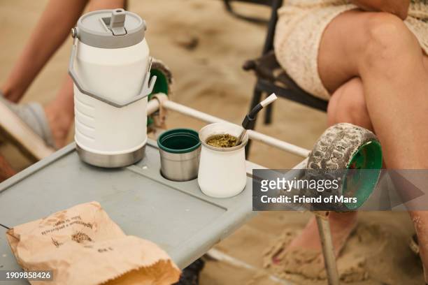 erva matte tea chimarrao in traditional cup on the beach with flask - erva stock pictures, royalty-free photos & images