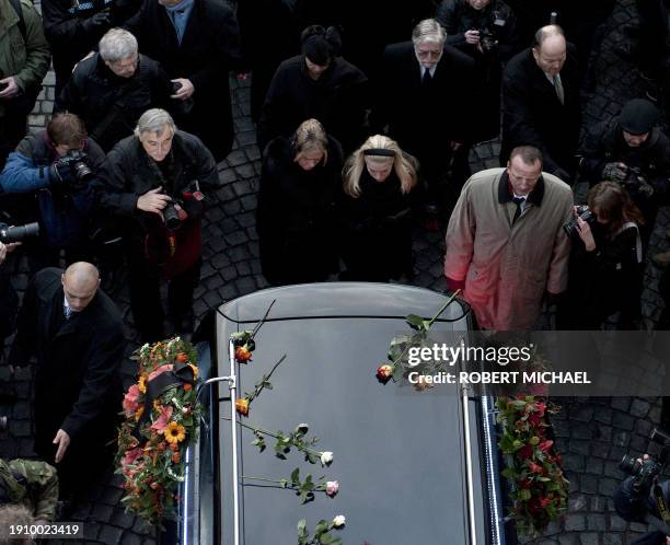 Dagmar Havlova , widow of former Czech President Vaclav Havel, her daughter Nina Veskrnova , and his brother Ivan Havel follow the hearse carrying...