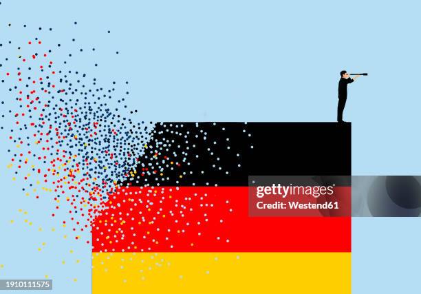 man standing on destructing german flag and looking through telescope against blue background - zerstört stock-grafiken, -clipart, -cartoons und -symbole