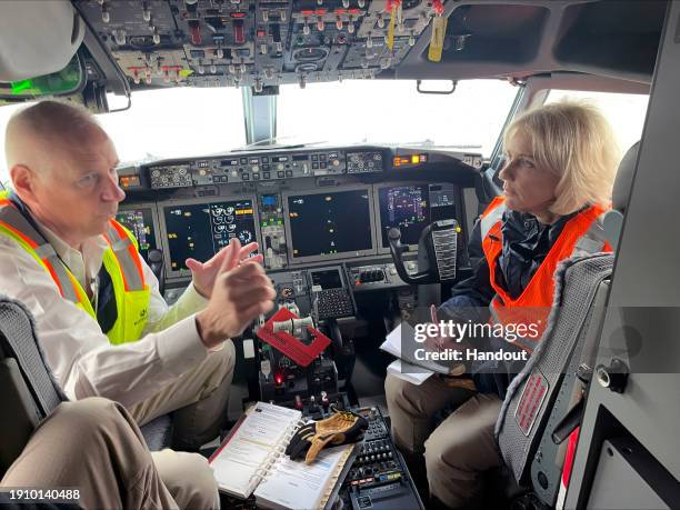 In this National Transportation Safety Board handout, members of the NTSB speak in the cockpit while examining Alaska Airlines Flight 1282 Boeing...