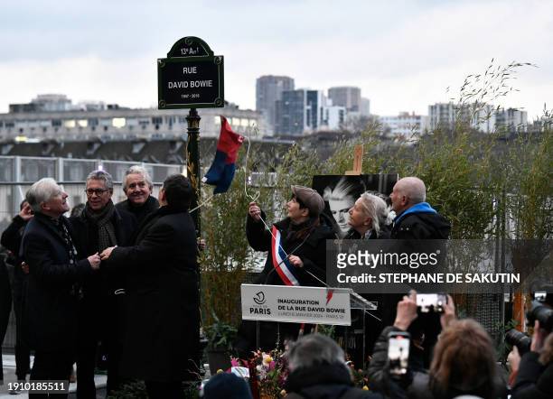 Deputy Mayor of Paris in charge of remembrance and veterans, Laurence Patrice , unveils a plaque during the inauguration of a street, named after...