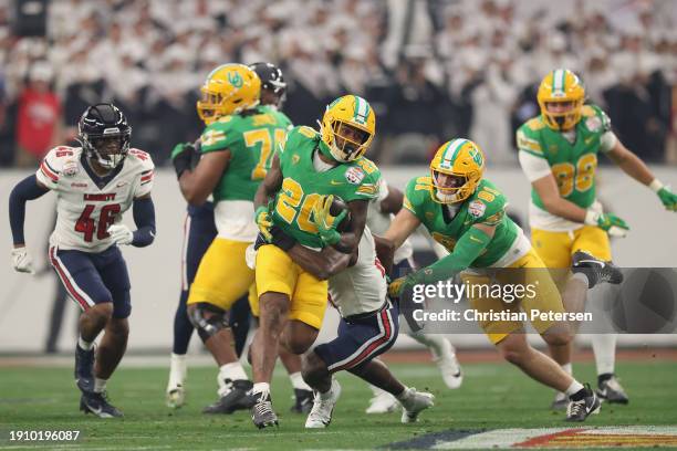 Running back Jordan James of the Oregon Ducks rushes the football against the Liberty Flames during the first half of the Fiesta Bowl at State Farm...