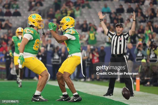 Wide receiver Gary Bryant Jr. #2 of the Oregon Ducks celebrates with Patrick Herbert after scoring a two-yard touchdown reception against the Liberty...