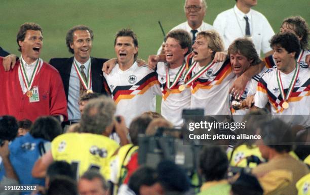 July 1990, Italy, Rom: Franz Beckenbauer celebrates winning the World Cup as coach of the German national soccer team in the Olympic Stadium in Rome,...