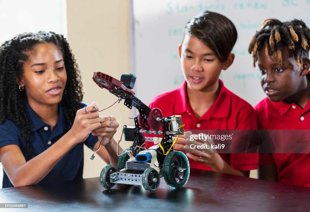 Students Using Robotics Multiracial Students In Robotics Class Build Robot Vehicle High-Res ...