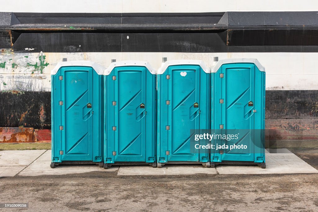 Blue mobile toilet unit is placed outside