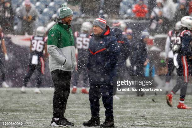 New York Jets quarterback Aaron Rodgers chats with New England Patriots head coach Bill Belichick during warm up before a game between the New...