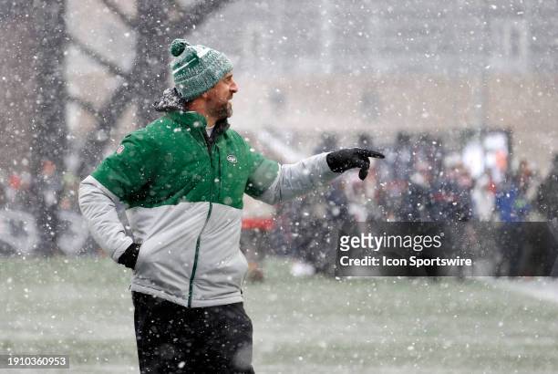 New York Jets quarterback Aaron Rodgers engages with fans during warm up before a game between the New England Patriots and the New York Jets on...