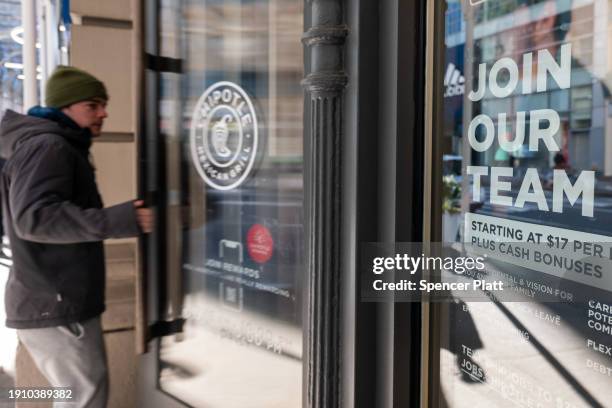 Help wanted sign is displayed outside of a restaurant in Manhattan on January 05, 2024 in New York City. As the American economy continues to...