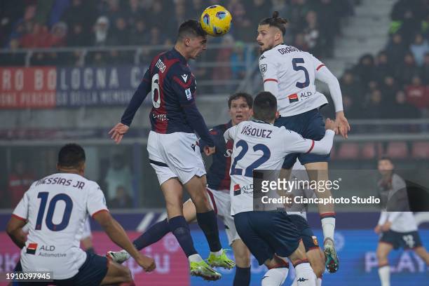 Nikola Moro of Bologna FC competes for the ball with Radu Dragusin of Genoa CFC during the Serie A TIM match between Bologna FC and Genoa CFC at...