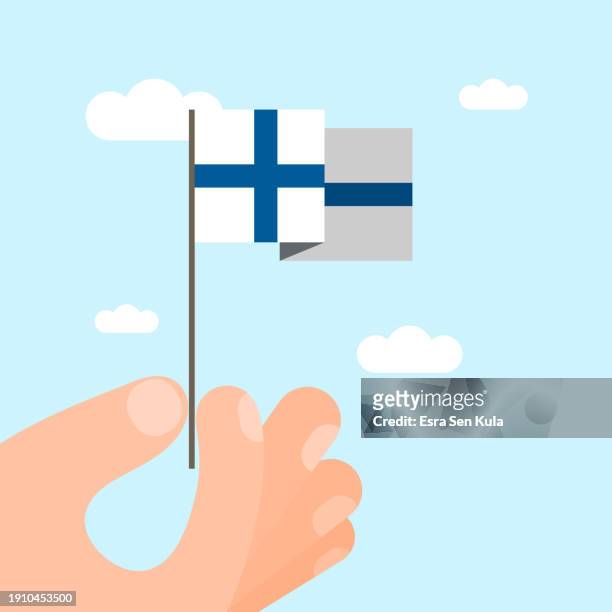 eine illustration einer in der hand gehaltenen finnischen nationalflagge. diese vektorillustration im minimalistischen stil eignet sich für die verwendung auf websites, webbannern, postern, mailing-vorlagen und sozialen medien. - pesäpallo stock-grafiken, -clipart, -cartoons und -symbole