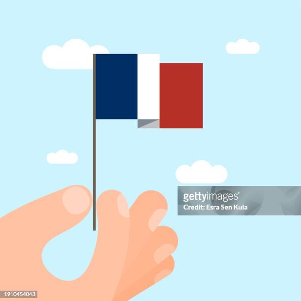 an illustration of a hand-held french national flag. this minimalist style vector illustration is suitable for use on websites, web banners, posters, mailing templates, and social media. - epiphany stock illustrations
