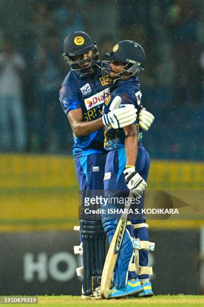 Sri Lanka's Jeffrey Vandersay and Sri Lanka's Dushmantha Chameera celebrate after Sri Lanka won by 2 wickets during the second one-day international...