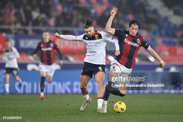 Radu Dragusin of Genoa CFC and Giovanni Fabbian of Bologna FC battle for possession during the Serie A TIM match between Bologna FC and Genoa CFC at...