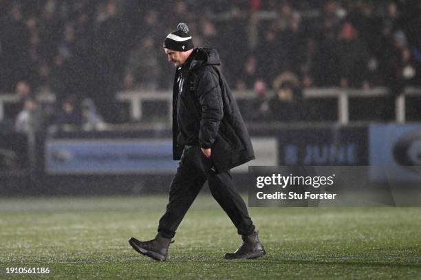 Falcons head coach Alex Codling walks across the pitch at half time during the Gallagher Premiership Rugby match between Newcastle Falcons and...