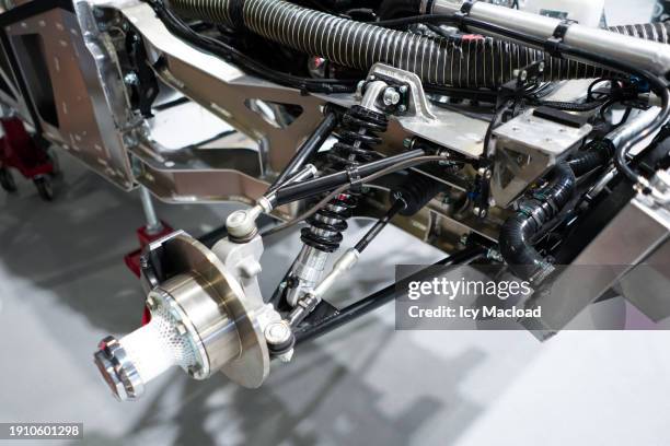 mechanical parts of a car being assembled - shock absorber stock pictures, royalty-free photos & images