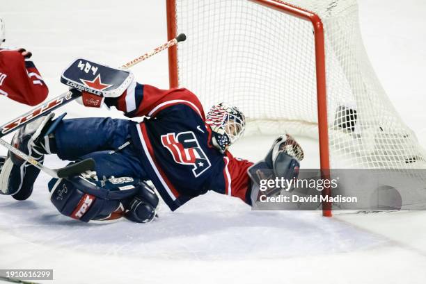 Goalie Sara DeCosta of the USA attempts to save a shot from Danielle Goyette of Canada during the gold medal match played February 21, 2002 during...