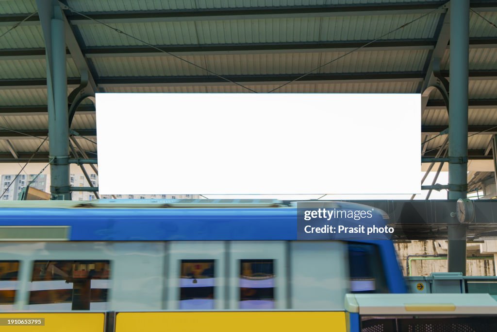 White billboard mock up is located on subway or train station to advertise